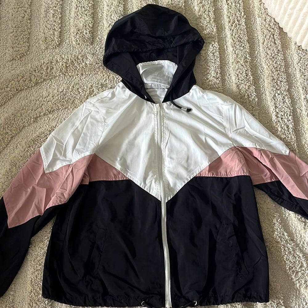 Women pink, white, and black wind breaker
